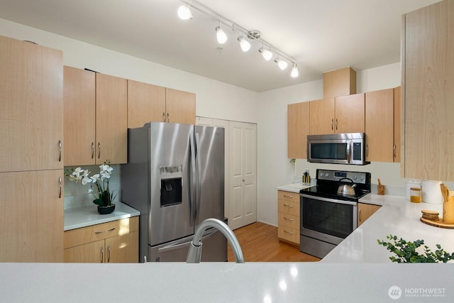 588 241st Ln SE, Sammamish, WA 98074 - kitchen with light countertops, light brown cabinets, and stainless steel appliances