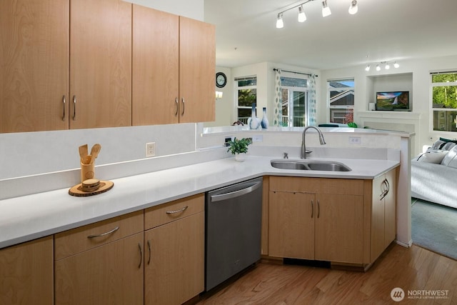 588 241st Ln SE, Sammamish, WA 98074 - kitchen with stainless steel dishwasher, a sink, light countertops, a peninsula, and open floor plan