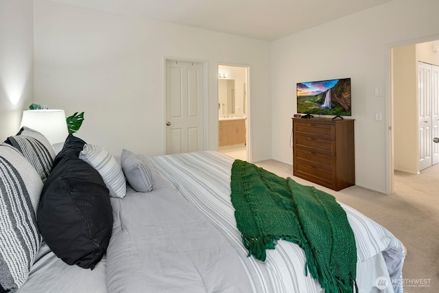 588 241st Ln SE, Sammamish, WA 98074 - bedroom with baseboards, ensuite bathroom, and light carpet