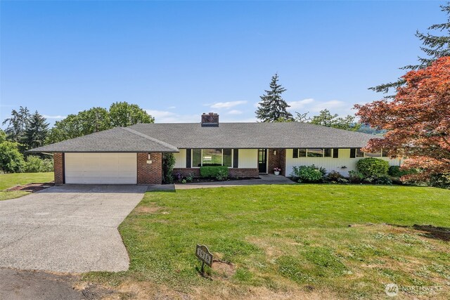 1918 SE Maple Dr, Chehalis, WA 98532 - single story home with an attached garage, driveway, a front yard, and a chimney