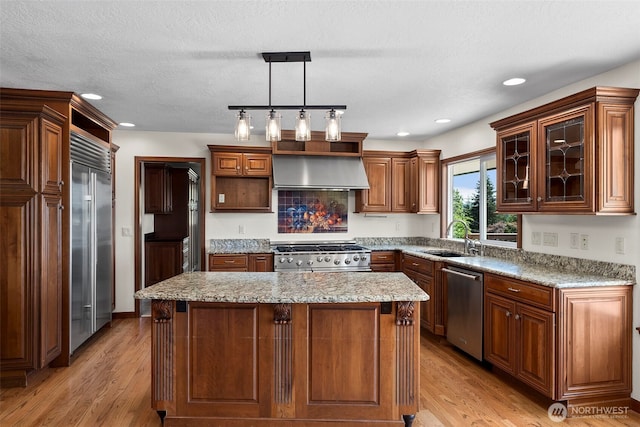 1918 SE Maple Dr, Chehalis, WA 98532 - kitchen featuring a sink, stainless steel appliances, open shelves, wall chimney exhaust hood, and light wood-type flooring