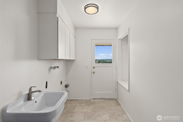 1918 SE Maple Dr, Chehalis, WA 98532 - washroom featuring baseboards, hookup for a washing machine, and cabinet space