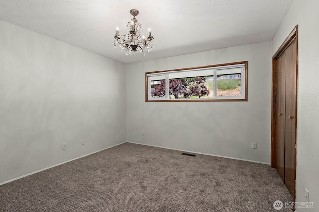 1918 SE Maple Dr, Chehalis, WA 98532 - unfurnished bedroom with a chandelier, carpet, baseboards, and a closet