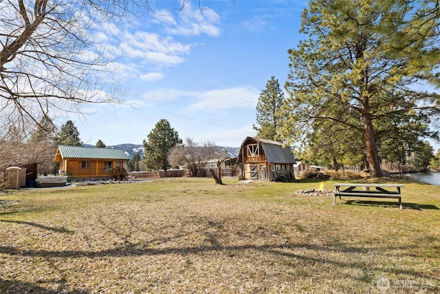 view of yard with a barn and an outdoor structure
