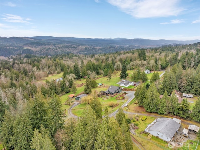 21401 161st Ave E, Graham, WA 98338 - drone / aerial view with a mountain view and a forest view