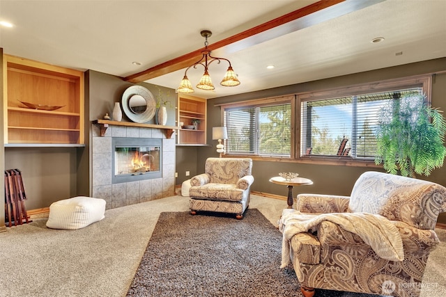 21401 161st Ave E, Graham, WA 98338 - living room with beamed ceiling, a healthy amount of sunlight, a tile fireplace, and carpet