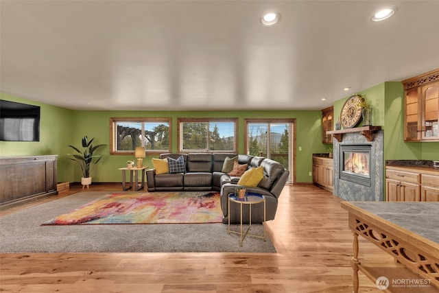 21401 161st Ave E, Graham, WA 98338 - living room with recessed lighting, light wood-type flooring, baseboards, and a fireplace