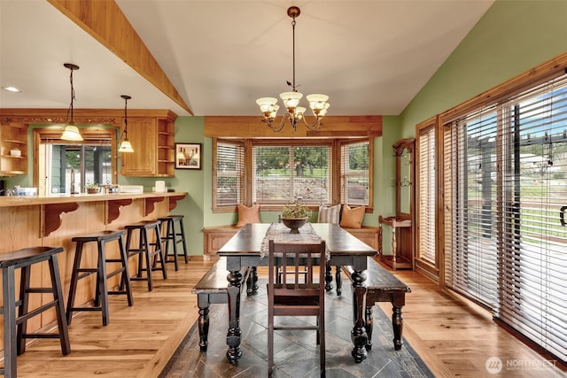 21401 161st Ave E, Graham, WA 98338 - dining space featuring lofted ceiling, light wood-style floors, and a chandelier