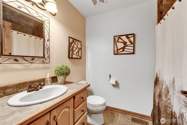 21401 161st Ave E, Graham, WA 98338 - full bath featuring visible vents, toilet, tile patterned flooring, baseboards, and vanity