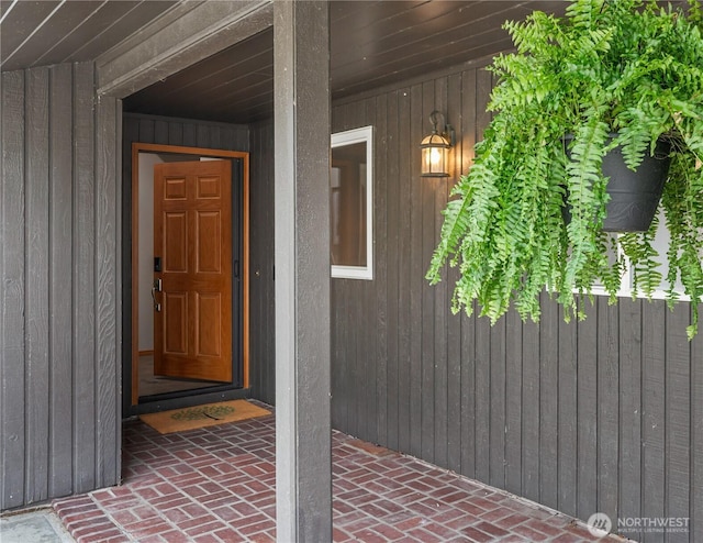 doorway to property with board and batten siding