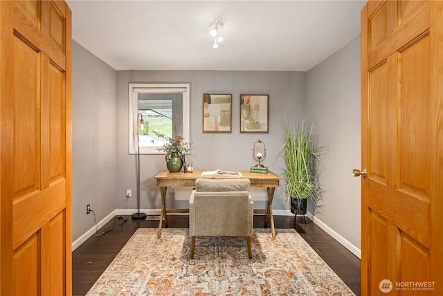 home office featuring dark wood finished floors and baseboards