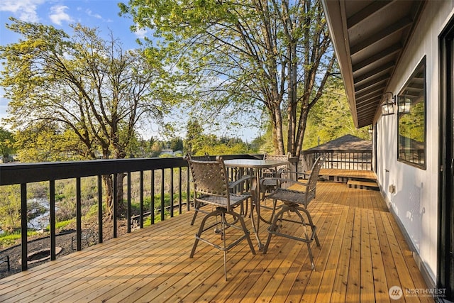 10231 Kiwa Dr SE, Olympia, WA 98513 - wooden deck with outdoor dining space