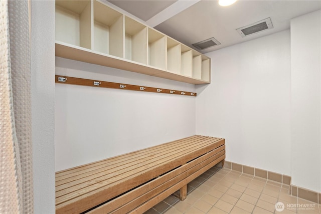 view of sauna with tile patterned floors and baseboards