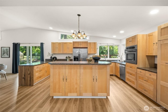 30427AVE SE 204th, Kent, WA 98042 - kitchen featuring stainless steel appliances, lofted ceiling, a kitchen island, light brown cabinets, and light wood-style floors