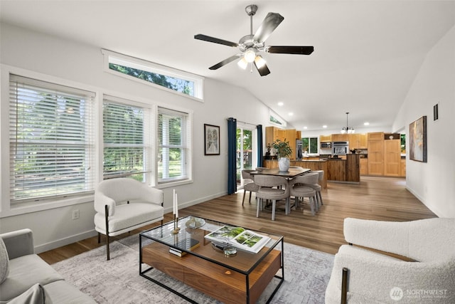 30427AVE SE 204th, Kent, WA 98042 - living room with plenty of natural light, vaulted ceiling, ceiling fan, light wood-style flooring, and recessed lighting