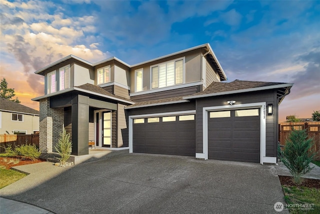 12673 SE 287th Ct, Auburn, WA 98092 - prairie-style house with concrete driveway, fence, and a garage