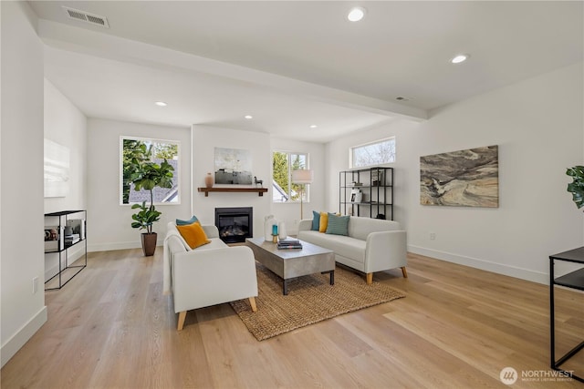 6732 21st Ave SW, Seattle, WA 98106 - living area with plenty of natural light, light wood finished floors, baseboards, and recessed lighting