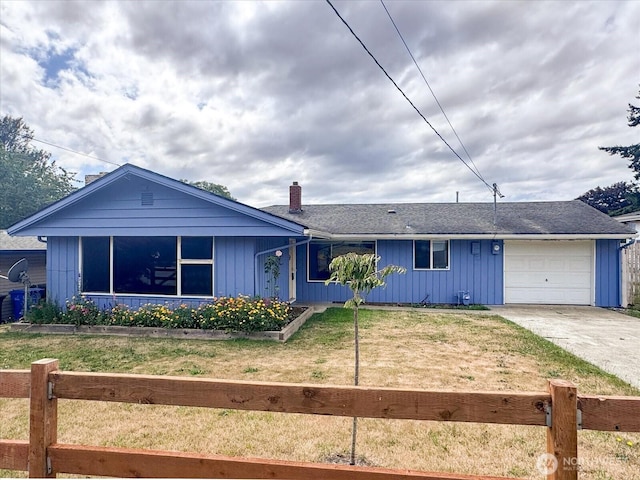 475 SE Pasek St, Oak Harbor, WA 98277 - single story home featuring a fenced front yard, a garage, concrete driveway, and a chimney