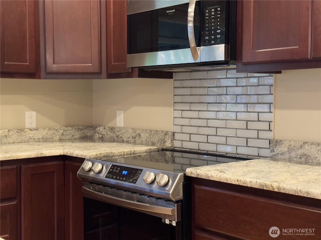 kitchen featuring decorative backsplash and stainless steel appliances