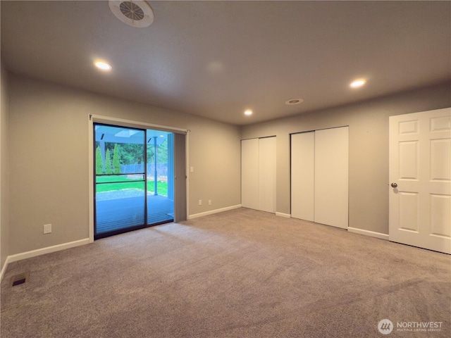 unfurnished bedroom with multiple closets, visible vents, carpet, access to outside, and recessed lighting
