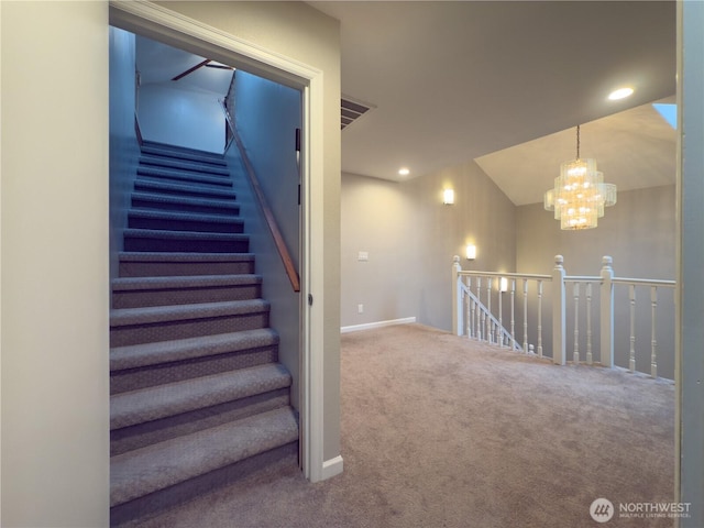 stairs featuring visible vents, recessed lighting, carpet, and an inviting chandelier
