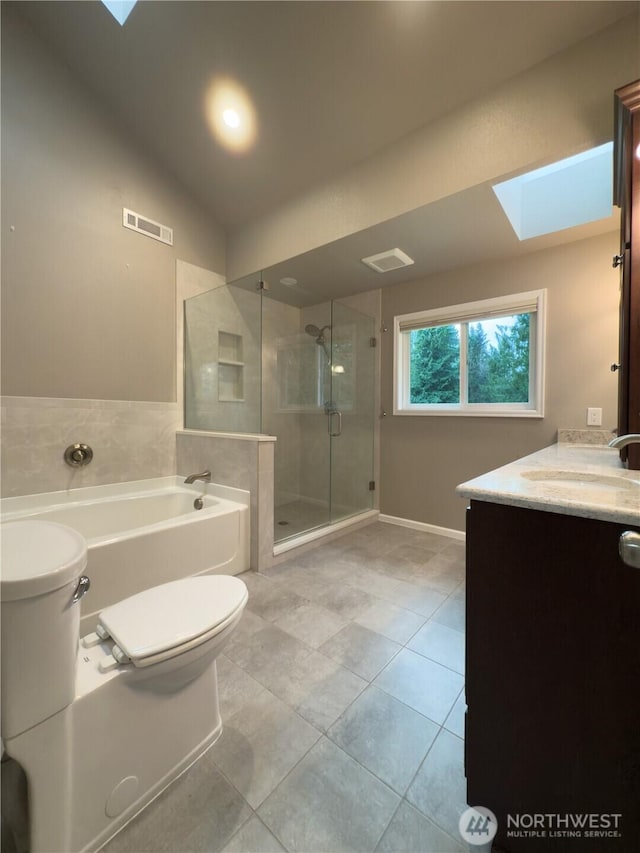 full bath with vanity, toilet, a shower stall, a garden tub, and visible vents