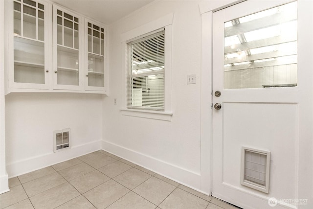 515 S 37th, Tacoma, WA 98418 - entryway with light tile patterned flooring, baseboards, and visible vents