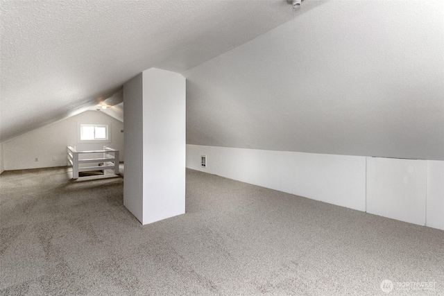 515 S 37th, Tacoma, WA 98418 - bonus room featuring lofted ceiling, a textured ceiling, and carpet