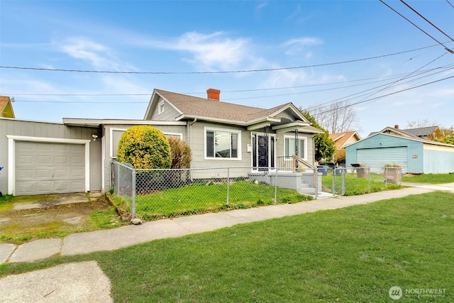 515 S 37th, Tacoma, WA 98418 - view of front of house featuring a front lawn, a chimney, a fenced front yard, and a garage