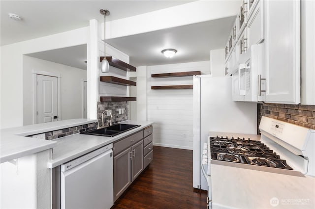 kitchen with open shelves, white appliances, light countertops, a sink, and backsplash