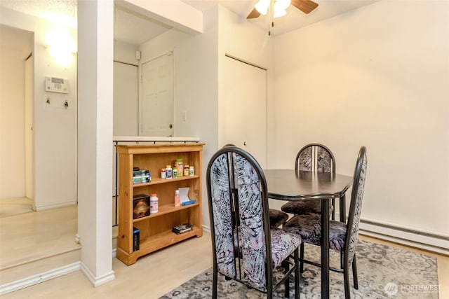 17514 151st Ave SE Unit 1-16, Renton, WA 98058 - dining space with ceiling fan and wood finished floors