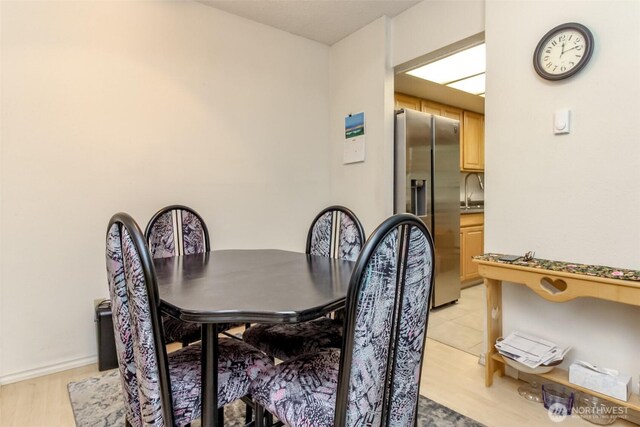 17514 151st Ave SE Unit 1-16, Renton, WA 98058 - dining space with light wood-style flooring