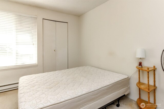 17514 151st Ave SE Unit 1-16, Renton, WA 98058 - bedroom featuring a closet and a baseboard radiator
