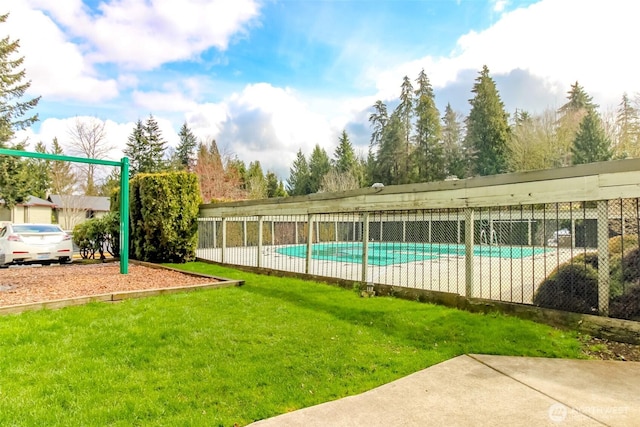 17514 151st Ave SE Unit 1-16, Renton, WA 98058 - view of swimming pool featuring fence, a fenced in pool, and a lawn