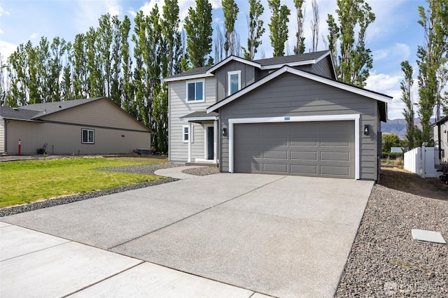 425 Pear Dr, Tieton, WA 98947 - view of front of property featuring concrete driveway, a front lawn, and an attached garage