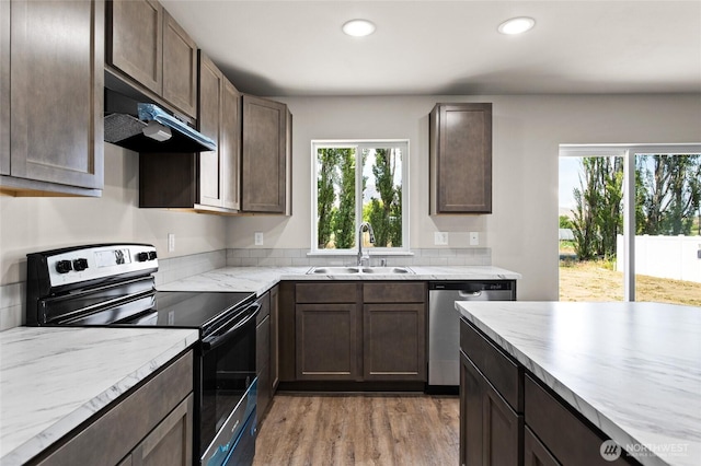 425 Pear Dr, Tieton, WA 98947 - kitchen with a sink, dishwasher, range with electric stovetop, light wood-style flooring, and recessed lighting