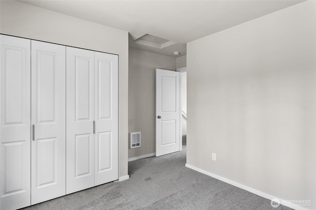 425 Pear Dr, Tieton, WA 98947 - unfurnished bedroom featuring carpet flooring, a closet, baseboards, and visible vents