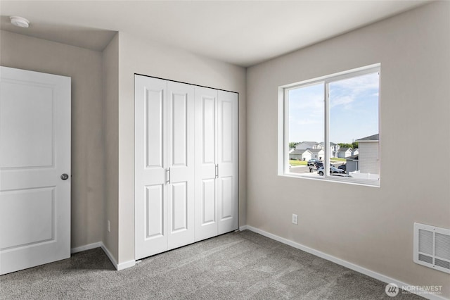 425 Pear Dr, Tieton, WA 98947 - unfurnished bedroom featuring carpet flooring, baseboards, a closet, and visible vents