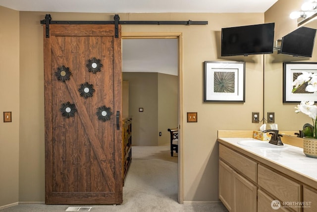 bathroom with baseboards and vanity