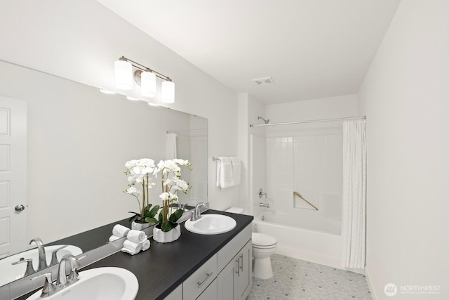 full bath with toilet, a sink, shower / bath combo, and visible vents