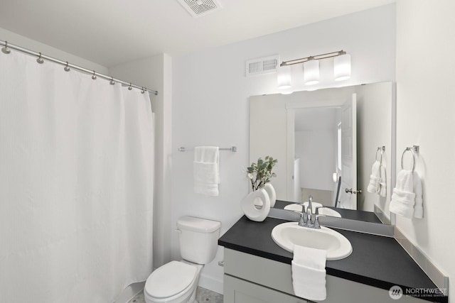 full bathroom with visible vents, toilet, and vanity