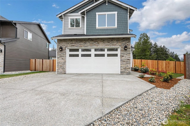 17318 74th Avenue Ct E, Puyallup, WA 98375 - view of front of property with stone siding, driveway, fence, and a garage