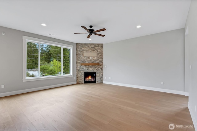 17318 74th Avenue Ct E, Puyallup, WA 98375 - unfurnished living room with a ceiling fan, light wood-style floors, baseboards, a fireplace, and recessed lighting