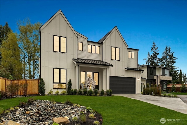 modern inspired farmhouse with fence, a garage, board and batten siding, concrete driveway, and a standing seam roof