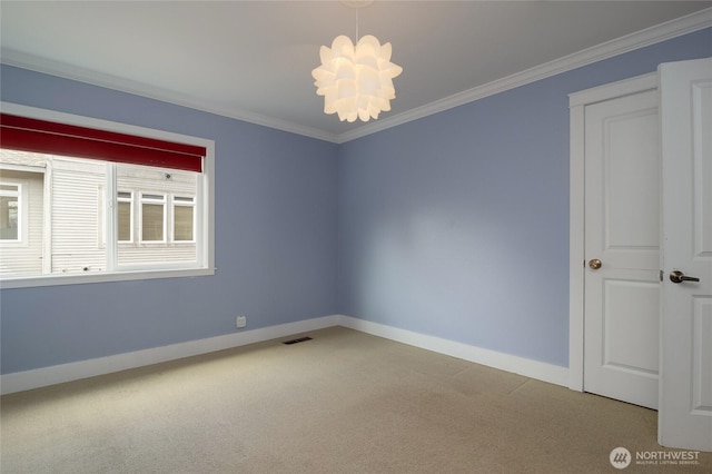 816 Washington St, Walla Walla, WA 99362 - carpeted empty room featuring an inviting chandelier, baseboards, ornamental molding, and visible vents