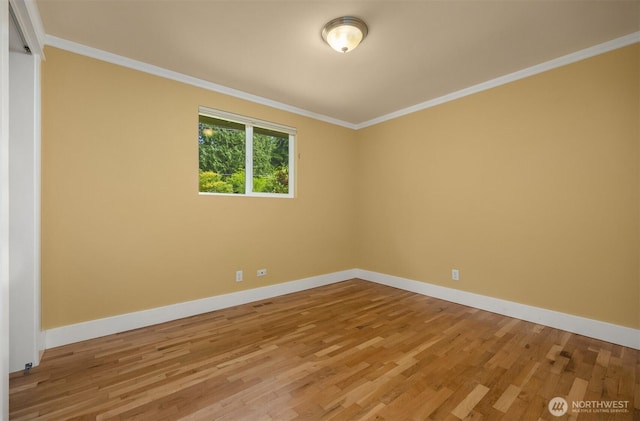 737 Park Ave NE, Bainbridge Island, WA 98110 - spare room with light wood-style flooring, baseboards, and ornamental molding