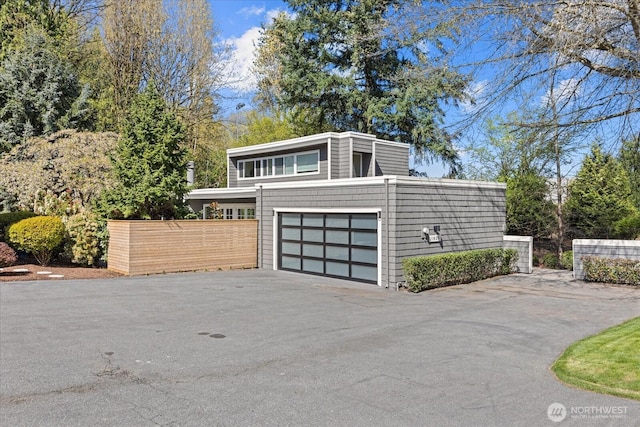 1825 112th Ave NE, Bellevue, WA 98004 - garage featuring driveway and fence