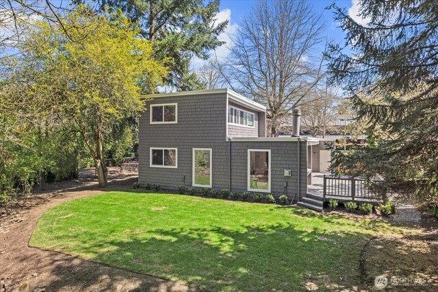 1825 112th Ave NE, Bellevue, WA 98004 - rear view of property featuring a deck and a lawn