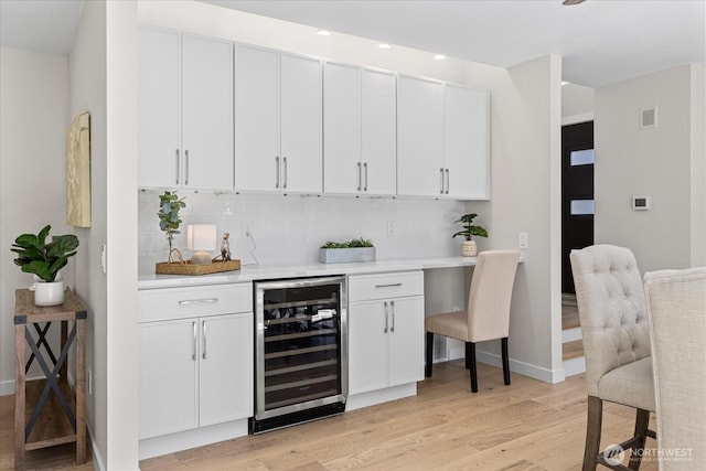 1825 112th Ave NE, Bellevue, WA 98004 - bar with light wood-type flooring, wet bar, wine cooler, visible vents, and decorative backsplash