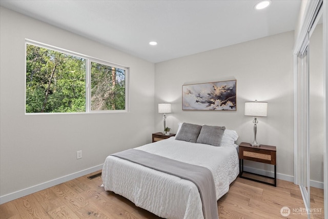 1825 112th Ave NE, Bellevue, WA 98004 - bedroom featuring light wood finished floors, baseboards, and recessed lighting